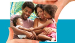 African American father and mother siting with infant child and toddler